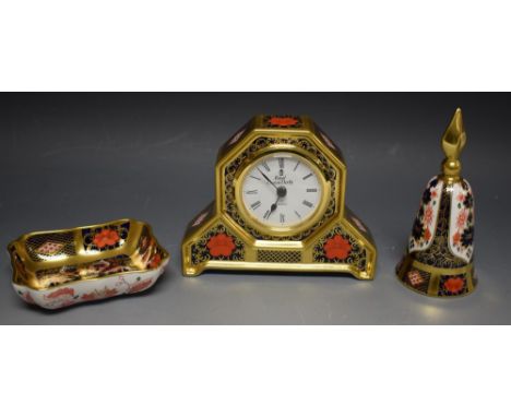 A Royal Crown Derby - an 1128  imari pattern clock, shaped case, quartz movement;  trinket dish and bell snuffer (3)