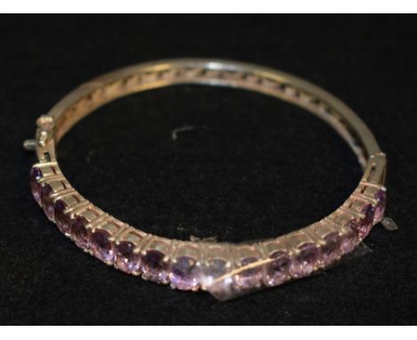 An amethyst and silver hinged bangle
