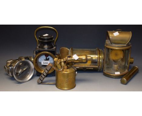 A pair of Victoria brass arch top carriage lamps, concave glass lenses, open grill base, tubular spikes; a King of The Road c