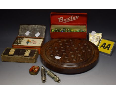 An AA enamel square car badge; another; a set of early 20th century dominoes, boxed; glass marbles, early 20th century and on