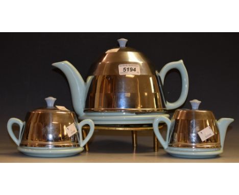 An insulated ceramic and chrome Art Deco style teapot, with sucrier and milk jug; a brass trivet