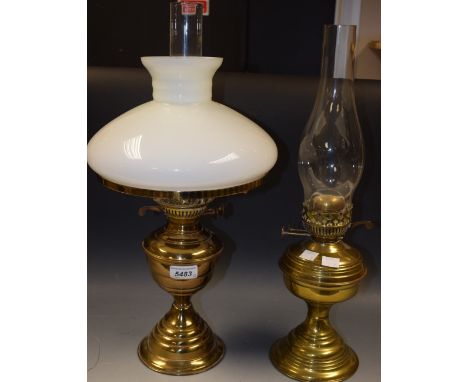 A brass oil lamp, Duplex twin burner, white opaque shade, clear glass chimney; another oil lamp with Duplex twin burner (2)