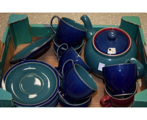 A Denby stoneware Harlequin pattern cream jug on stand, sugar bowl, teapot, four tea cups and saucers, three ramekins on sauc