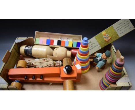 Toys - a painted carved wooden clown doll/puppet;  a bear rower in boat;  two ring/disc towers;  wooden racing car;  musical 