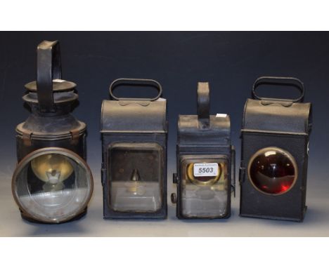 A black lacquered British Rail signal lamp, marked BR; others smaller, each with different shaped lens (4) 