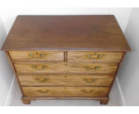 An 19thC mahogany dressing chest, having two short and three graduated long drawers with cock beading and brass bail handles,