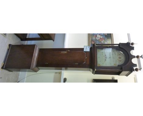 An early 19thC oak longcase clock, the hood having twin fluted pillars, an arched top door and box base, on bracket feet; the