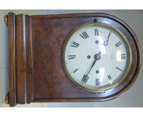 A 1930s figured walnut cased boardroom bracket clock, having a plain round arched top and straight sides, on bun feet; the 8 
