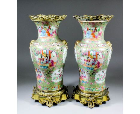 A pair of Chinese "Cantonese" porcelain baluster-shaped vases with later French gilt brass mounts, the baluster-shaped bodies