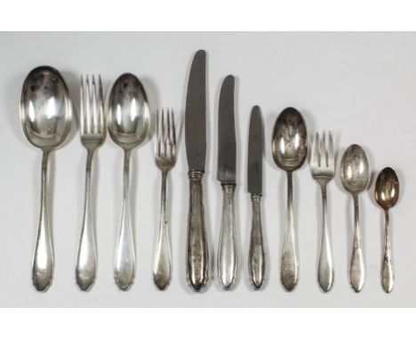 A Continental silvery metal part table service with moulded edge to handles, comprising -  seven table spoons, six dessert sp