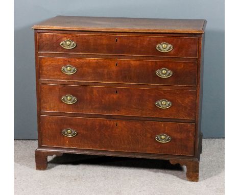 An 18th Century oak chest with moulded edge to top, fitted four long graduated drawers, on bracket feet, 40ins wide x 20.5ins