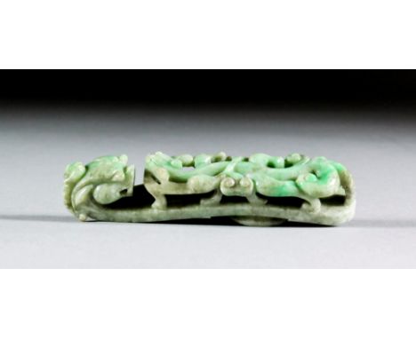 A Chinese jadeite belt hook pierced and carved in the form of a dragon, 3.5ins (9cm) overall (Qing Dynasty - 19th Century) No