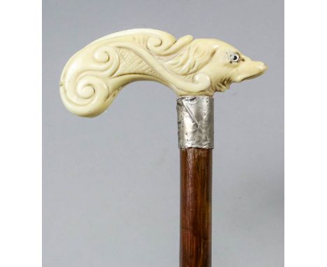 A late 19th/early 20th Century caved ivory and silver mounted "fish" pattern walking stick, the scroll-shaped handle carved w