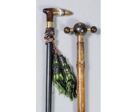 An agate and 15ct gold mounted walking stick, on ebonised shaft, 36ins overall, and a horn and gold coloured metal mounted wa