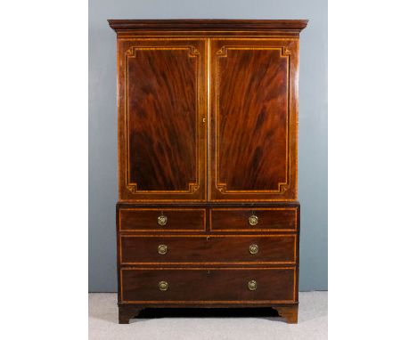 A late 19th Century gentleman's mahogany wardrobe, the front inlaid with satinwood bandings and boxwood stringings, the upper