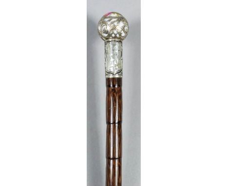 An early 20th Century Continental porcelain and plated metal mounted walking cane, the ball finial painted with a couple in a