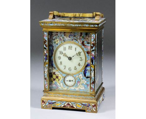 A late 19th/early 20th Century French carriage clock, the 2ins diameter cream enamel dial with gilt Arabic numerals and gilt 