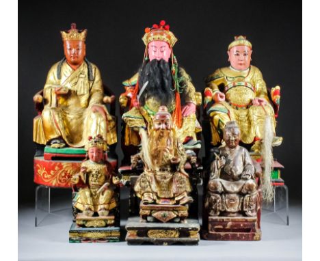 A large Chinese carved polychrome and giltwood seated figure of Da Dijan Xia - A seated Immortal, a fly whisk in his left han