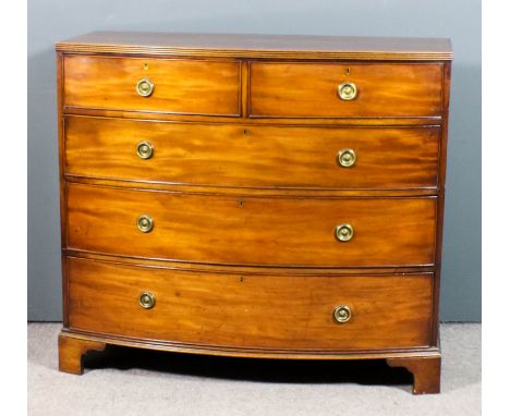 A George III mahogany bow front chest with reeded edge to top, fitted two short and three long drawers, on bracket feet, 44in