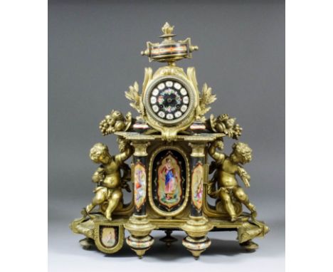 A late 19th Century French gilt metal and porcelain mounted mantel clock by Japy Freres, No. 1445, the 3.5ins diameter porcel