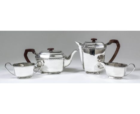 An Edward VIII silver four piece tea service, the plain hexagonal bodies with cast angled mounts and moulded footrims, compri