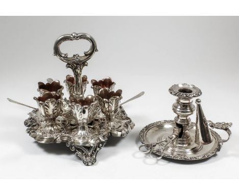An early 19th Century Sheffield plate circular six-division egg cruet, the whole of shaped outline with bold leaf scroll and 