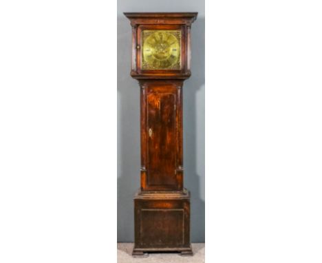 An 18th Century oak longcase clock by Minshul of Denbigh, the 13ins square brass dial with wide chapter ring (formerly silver