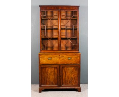 A mahogany Secretaire bookcase, the upper part with moulded cornice, fitted three shelves enclosed by a pair of astragal glaz