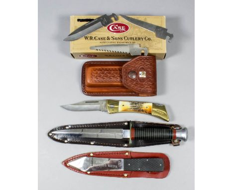 Three 20th Century hunting knives, comprising - one Sheffield sheath knife, one throwing knife by William Rogers, and a leath