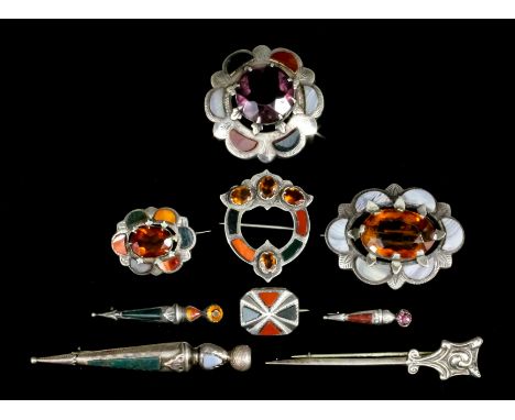 An early 20th Century Scottish silver mounted amethyst and hardstone set circular pattern plaid pin, 40mm diameter, and four 