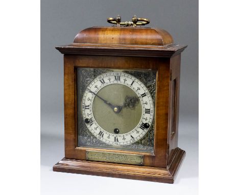 A mid-20th Century English walnut cased mantel clock of "17th Century" design, the 6ins square brass dial with narrow silvere