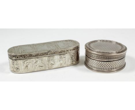 A Dutch silvery metal oblong snuff box the whole die stamped with various figures in landscapes within shell and scroll board