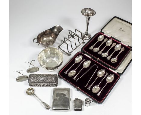 A George V silver sauce boat with crimped rim and double C-scroll handle, on paw feet, 3ins high, by Sharman D Neill Ltd of B