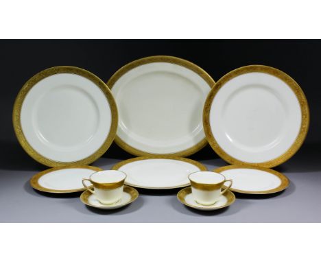 A Royal Worcester bone china part dinner service with cisele gilding to the rims, comprising - ten 10.5ins dinner plates, twe
