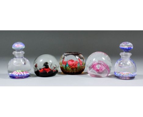 Two glass scent bottles, the bases and stoppers inset with millefiori coloured canes, 4ins high overall, and three modern Cai