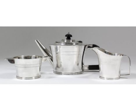 A George V and George VI harlequin silver circular three piece tea service of tapered form, with moulded rims and footrims an