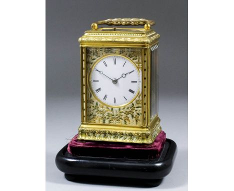 A late 19th Century French carriage clock, the 2.125ins diameter white enamel dial with Roman numerals, within gilt slip enam