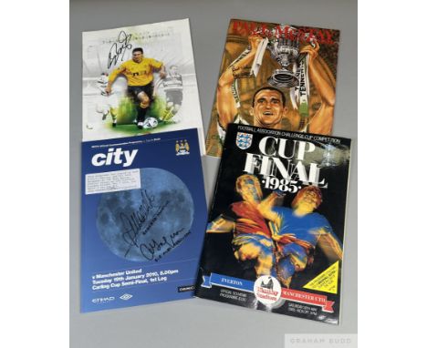 A file of Manchester United-autographed programmes,Team-signed 1985 & 1994 F.A. Cup Finals; 2010 Carling Cup semi-final signe