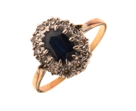 Unmarked sapphire and diamond cluster ring with central faceted oval dark blue stone, size S½, 3.6g gross approx  