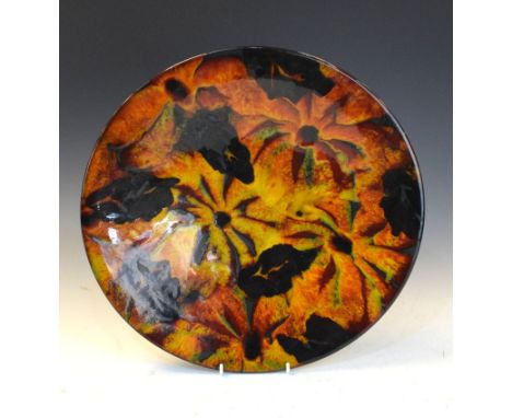 Janice Tchalenko for Poole Pottery - A charger decorated with orange flower heads, 41cm diameter  