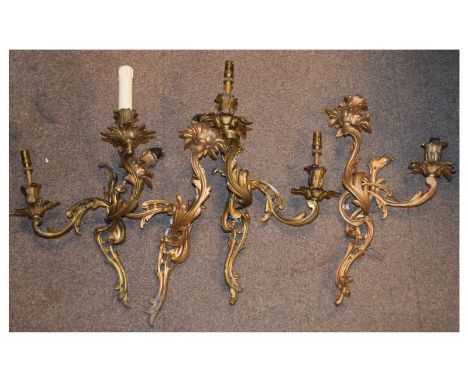 Set of four cast metal Rococo design wall lights, together with three wavy edge engraved vaseline glass light shades (7)  