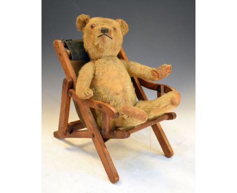 Vintage golden mohair children's teddy bear, having glass eyes, measures approximately 42cm tall, sat on small wooden deckcha