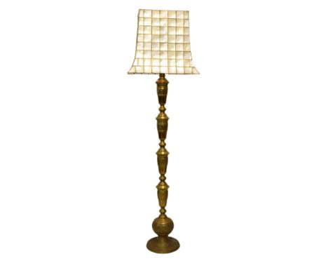 Eastern brass standard lamp with shell shade, 177cm high  