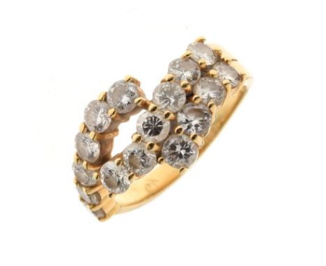 Yellow metal and diamond set dress ring, set sixteen small diamond brilliants in three strands, shank stamped 750 and 18Kt, s