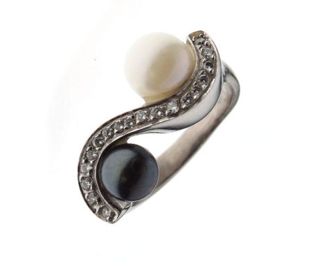 18ct gold, diamond and pearl dress ring set one natural and one dark grey pearl between diamond-set S-scroll, size K, 8.6g gr