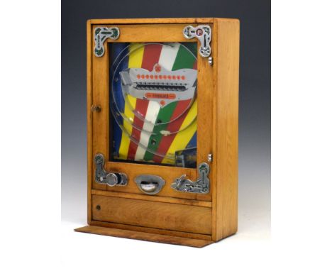 Bryans 'Elevenses' penny-in-the-slot arcade-style slot machine, oak-cased with metal mounts, stamped 2523 to roof, 64cm high 