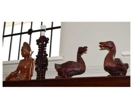 Pair of Oriental carved hardwood ducks, a carved seated female figure, and a pierced table lamp  