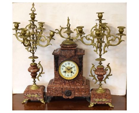Late 19th Century French gilt metal and pink granite three-piece clock garniture, the clock with cream Arabic dial and two-tr