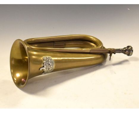 Military brass bugle having the Gloucestershire Regimental crest to top, measures approximately 35cm long  