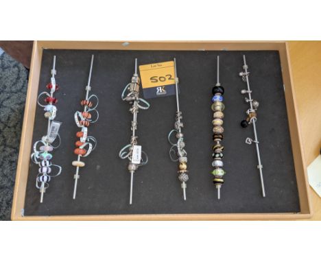 59 assorted charms. Including Jennifer Lopez &amp; Lovelinks
Wide variety of prices, in one instance exceeding £200
Please no